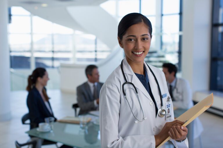 Portrait smiling female doctor in hospital meeting